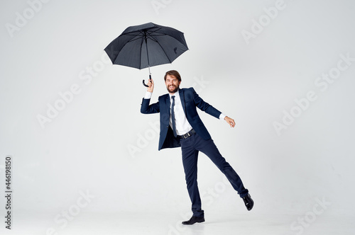 man in suit with umbrella emotions protection from rain © SHOTPRIME STUDIO