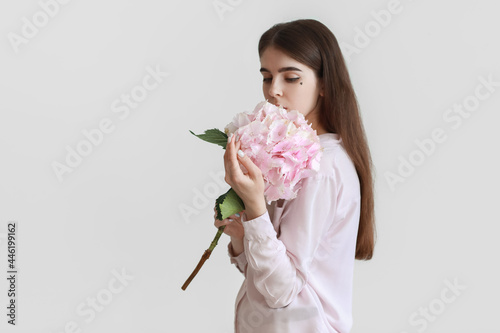 Young woman with hydrangea ...