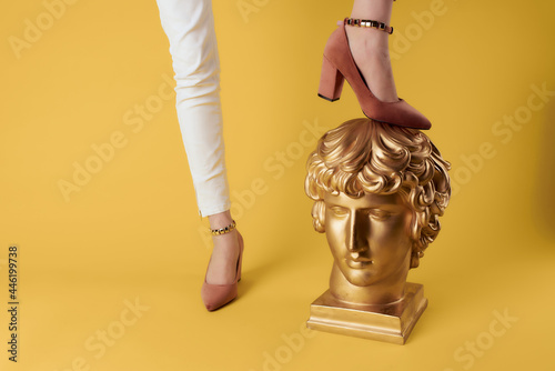 female feet shoes posing golden head showing