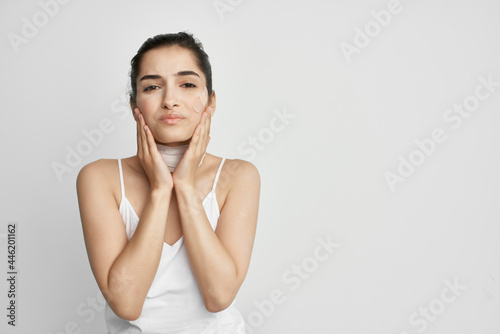 woman with closed eyes and holding her head depression emotions
