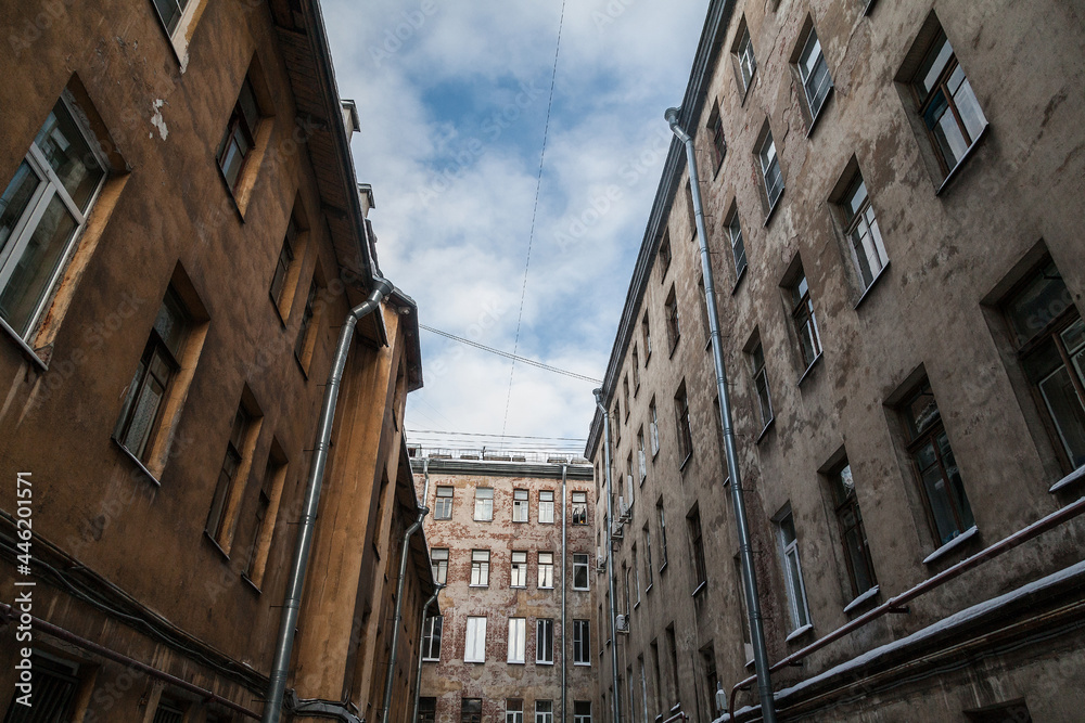Fototapeta premium Walls of old vintage apartment houses of St. Petersburg