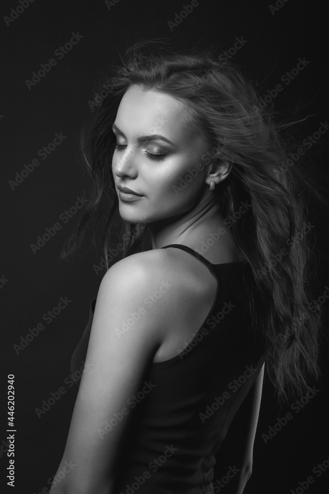 Stylish studio portrait of a lovely brunette woman with perfect makeup