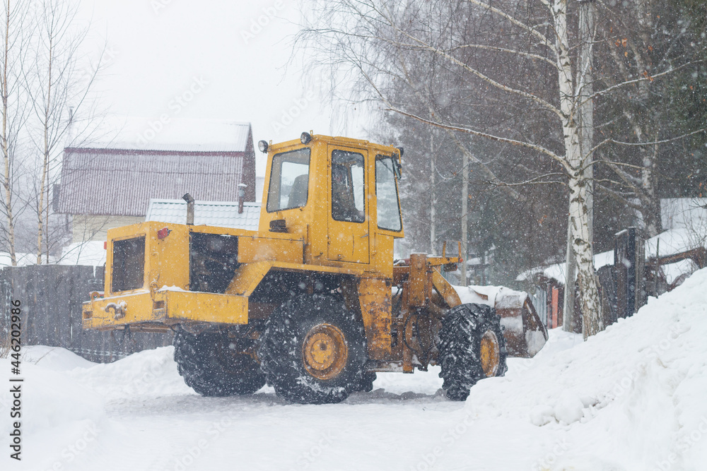 Special equipment clears snow in the park in winter Special equipment clears snow in the park in winter