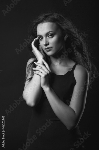 Stylish studio portrait of a glamor brunette woman with perfect makeup