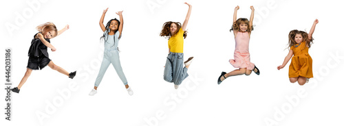 Art collage made of little and happy kids jumping isolated on white studio background. Human emotions, facial expression concept