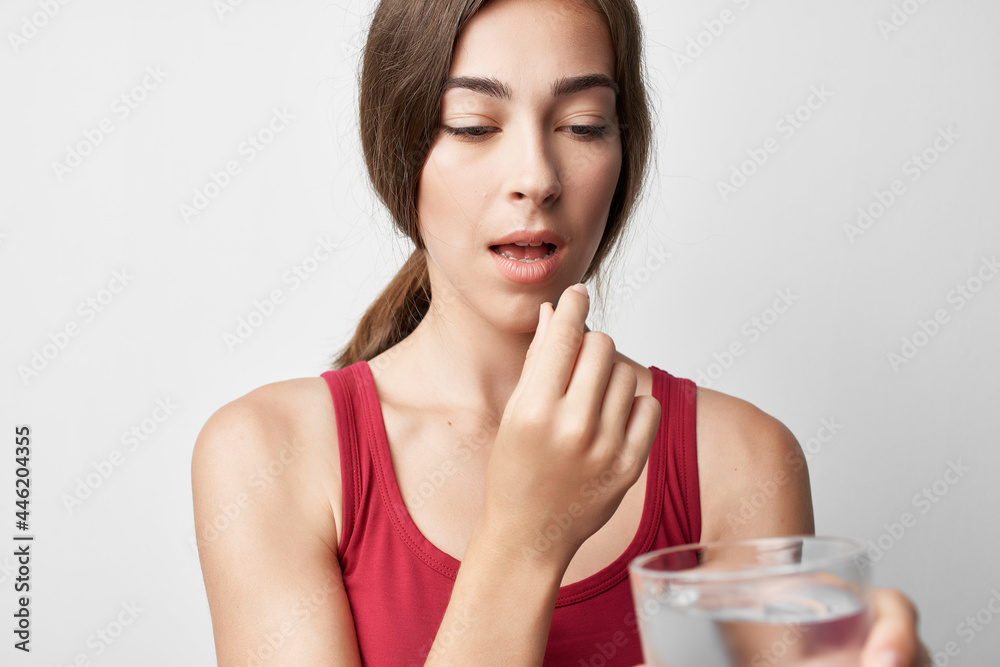 woman in red t-shirt iodine pills treatment medicine pharmacy woman in red t-shirt iodine pills treatment medicine pharmacy