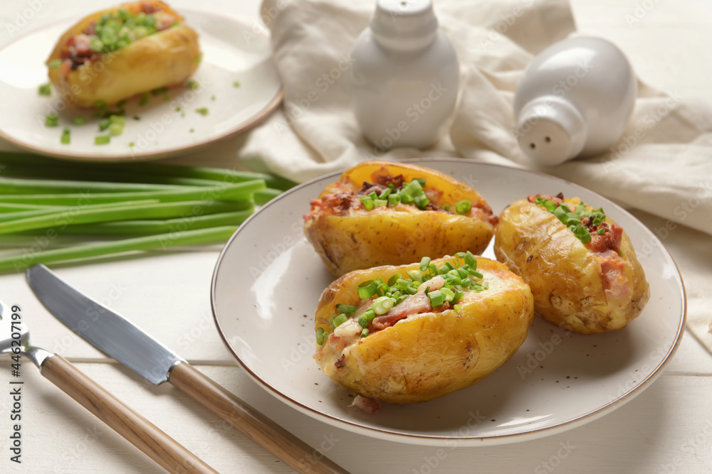 Plate with baked potato on table Plate with baked potato on table