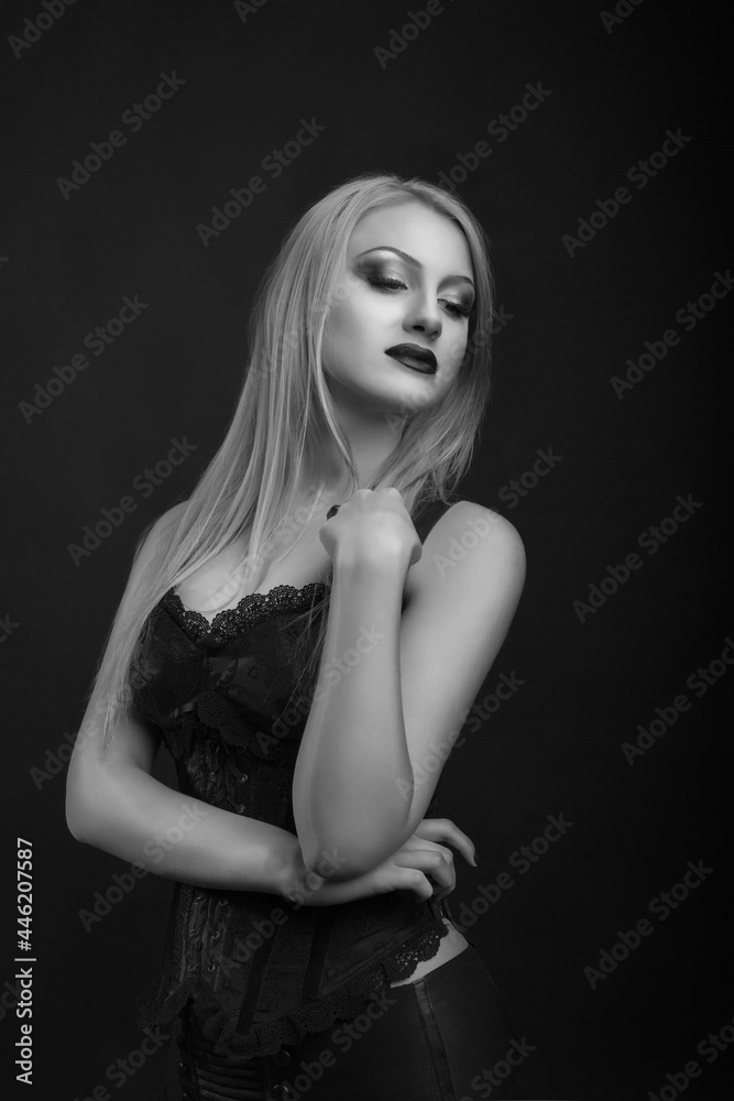 Beautiful woman with bright makeup and straight hair wears corset Beautiful woman with bright makeup and straight hair wears corset