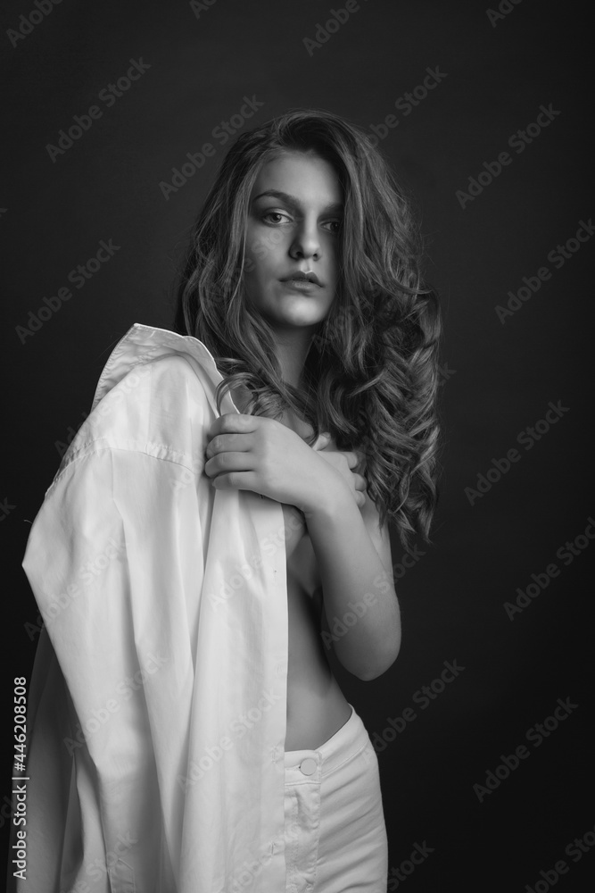 Passionate lady posing with bare shoulders at studio