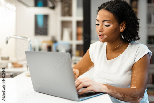 Attractive middle aged woman using laptop computer