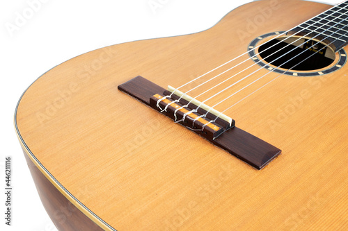 wooden acoustic guitar isolated over white background