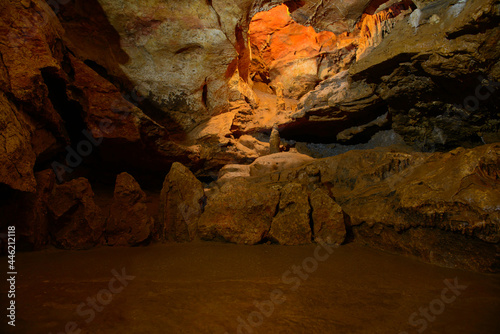 The corridors and walls of the cave are red