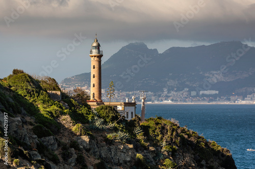 Punta Carnero Lighthouse and Rock of Gibraltar view near Algeciras, Punta Carnero cape, Province of Cádiz, Andalusia, Spain