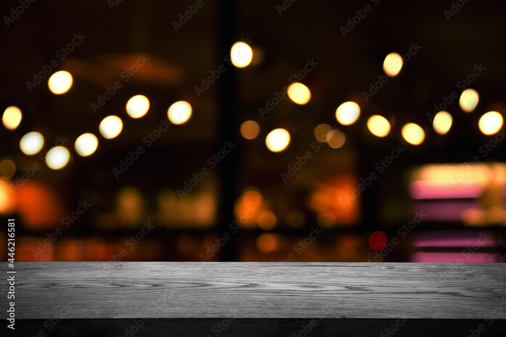 blurred cafe, reflected in the window, empty wooden black table.