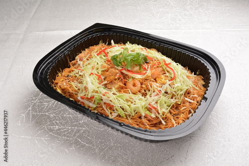 wok fried Singapore bee hoon noodle mee with prawn seafood in black party bento tray box for asian take away halal menu photo