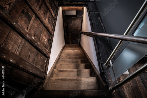 Old wooden stairs going down to a basement