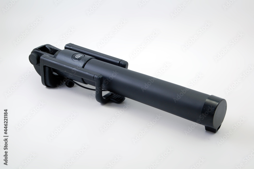 Black selfie stick with shutter button