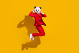 Photo of sportive crazy panda guy jump enjoy flight wear mask red tux shoes isolated on yellow color background