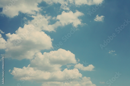 clouds on a vintage, blue sky background. abstract with blue sky and white clouds
