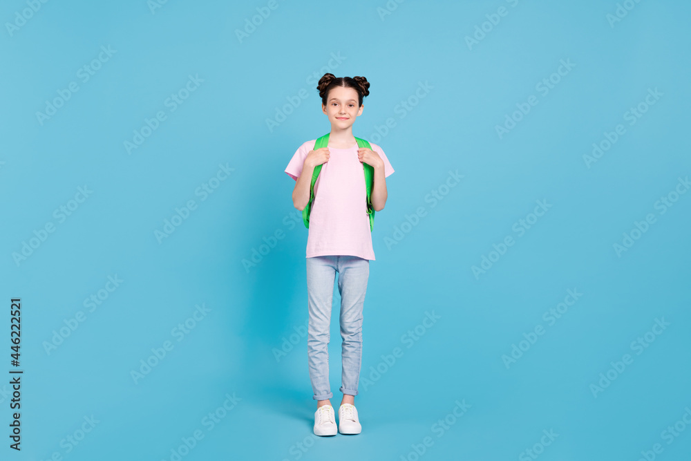 Photo of pretty charming schoolgirl dressed pink t-shirt rucksack smiling isolated blue color background Photo of pretty charming schoolgirl dressed pink t-shirt rucksack smiling isolated blue color background