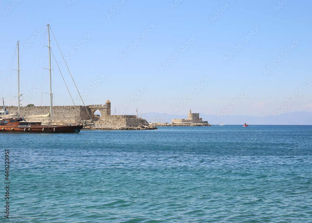 yachts seaport on background of ancient fortress