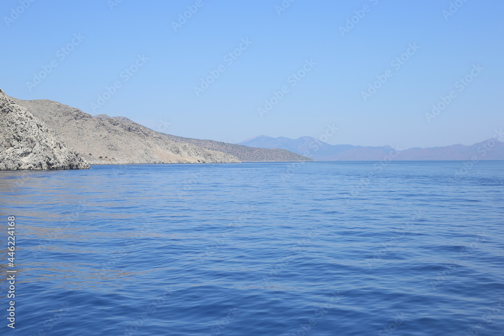 seashore rocky mediterranean landscape waves boat engine