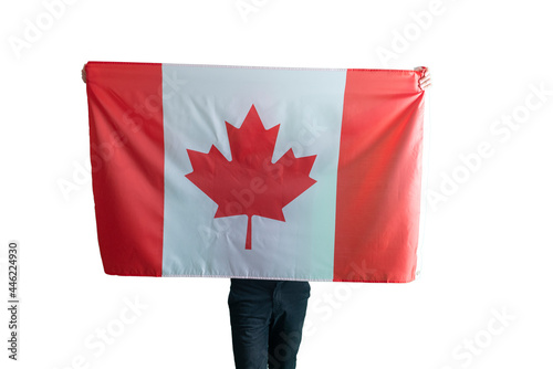 young man with a canada national flag on the soulders, patriotism and proud feelings, isolated white background photo