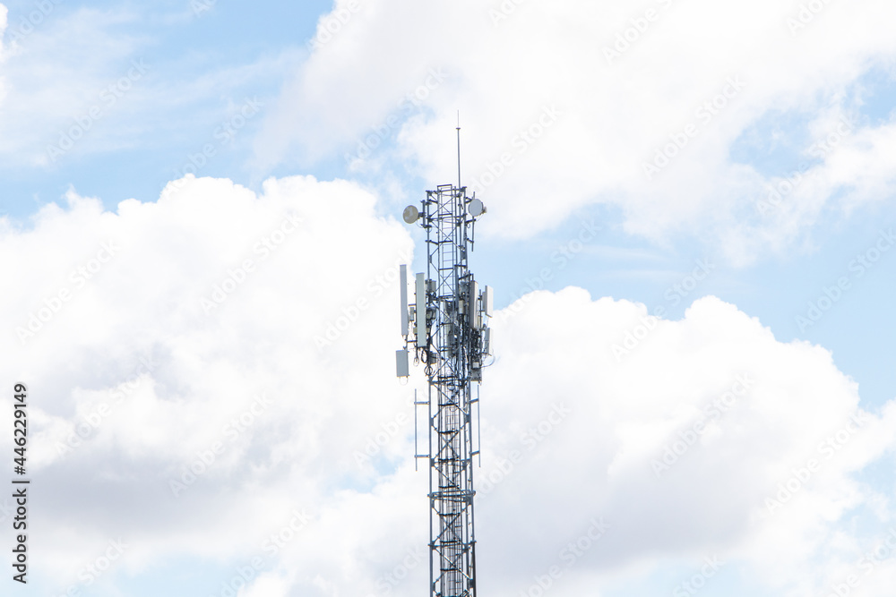 Wireless Communication Antenna Transmitter.Telecommunication tower 4G and 5G cellular Base Station or Base Transceiver Station. Telecommunication tower with antennas isolated on sky cloud  background