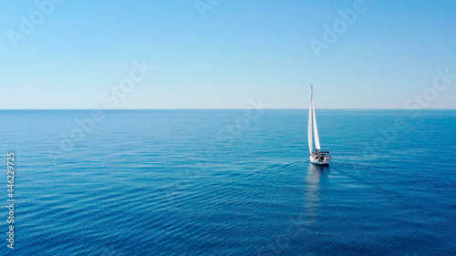 Fotografia Aerial view of sailing luxury yacht at opened sea at sunny day in Croatia