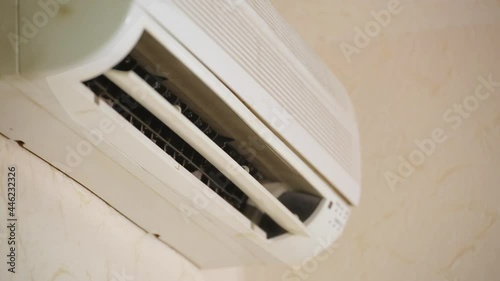 Old Split Air Conditioner Start Blowing To Cool Down Temperature In Office while there is a heat outside