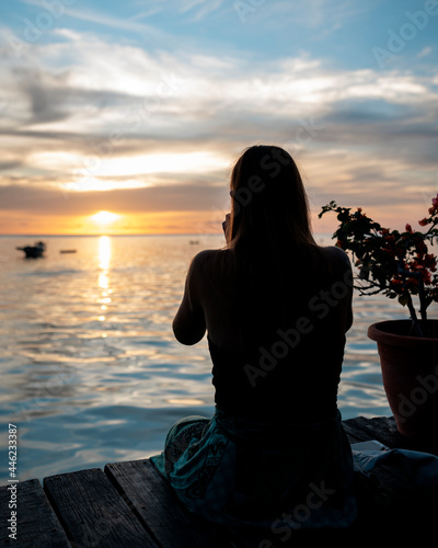 girl enjoying tea during sunset