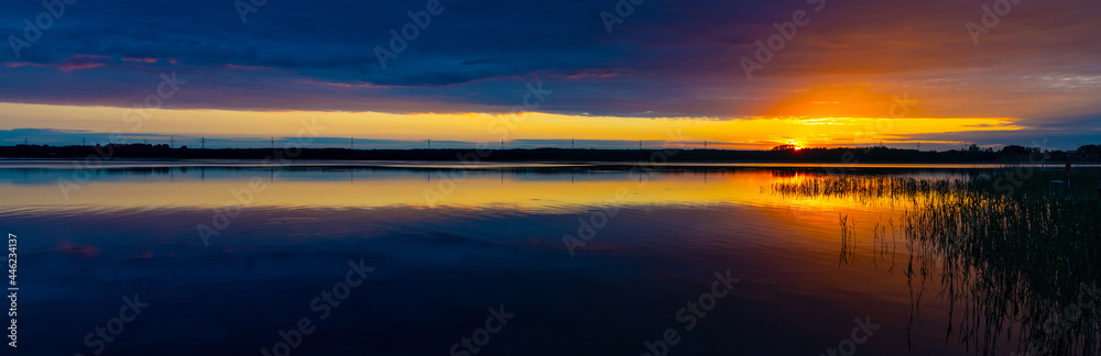 Panoramic summer sunset view of Jezioro Selmet Wielki lake landscape with colorful sky in Sedki village in Masuria region of Poland - obrazy, fototapety, plakaty 