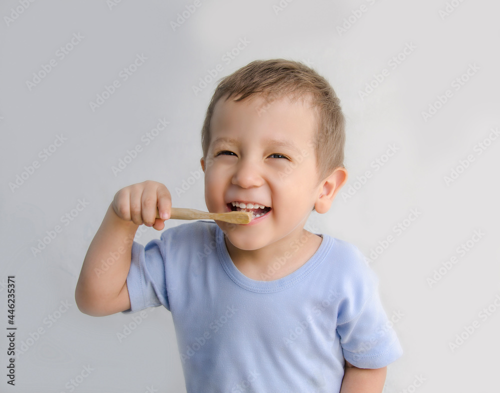 A child of European appearance, reads his teeth himself. The boy uses an eco-friendly toothbrush. Hygiene is good for the health of your teeth. A child of European appearance, reads his teeth himself. The boy uses an eco-friendly toothbrush. Hygiene is good for the health of your teeth.