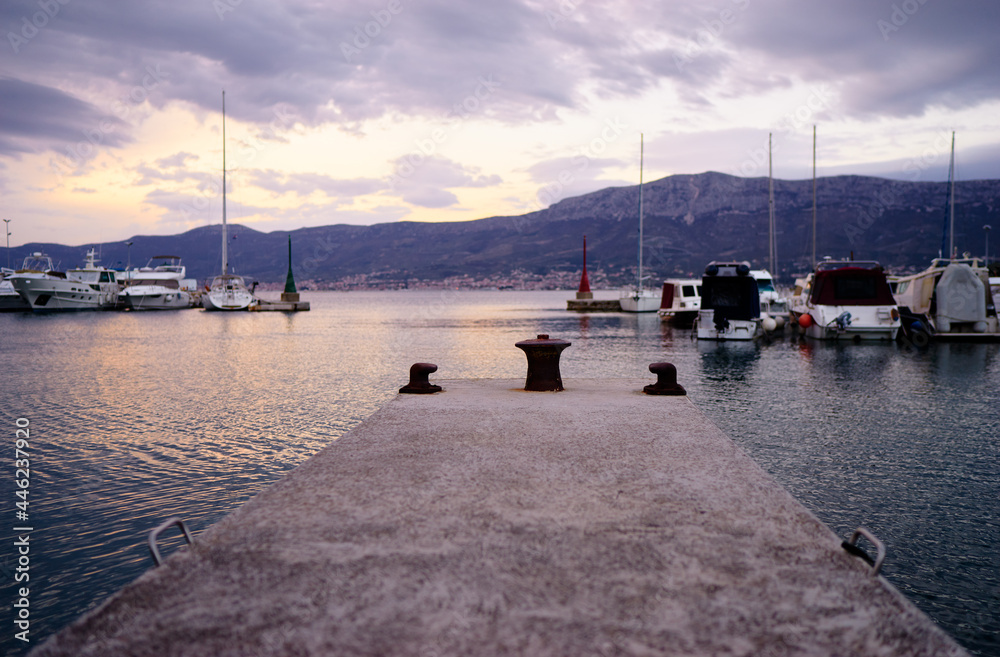 Concrete sea pier at Split marina with wonderful mountains view.