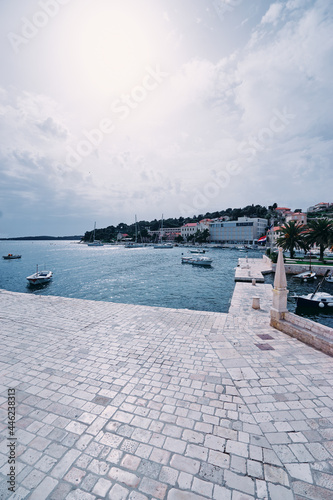 Hvar Old Town Promenade. Sea coast in Dalmatia,Croatia. A famous tourist destination on the Adriatic sea. Old town and marina. © luengo_ua