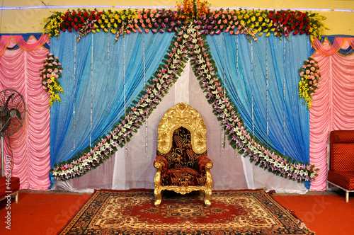 indian marriage wedding bride groom husband man seat chair floral decoration