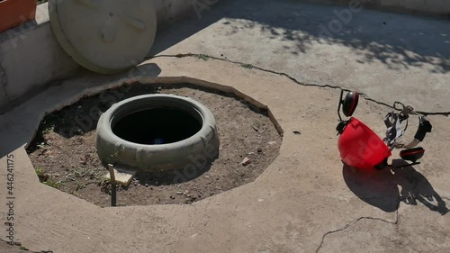 Wallpaper Mural red protective helmet with safety headphones rolling turning, fallen, next to an open tank of lpg, symbol of safety at work Torontodigital.ca