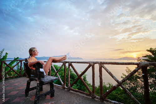 Wallpaper Mural Traveling by Thailand. Young woman enjoying wonderful sunset on Phuket island view point. Torontodigital.ca