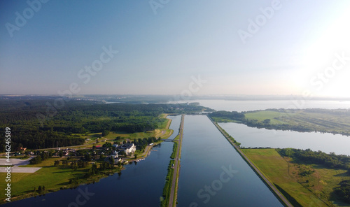 Aerial view of a beautiful flat blue channel and river © Payllik