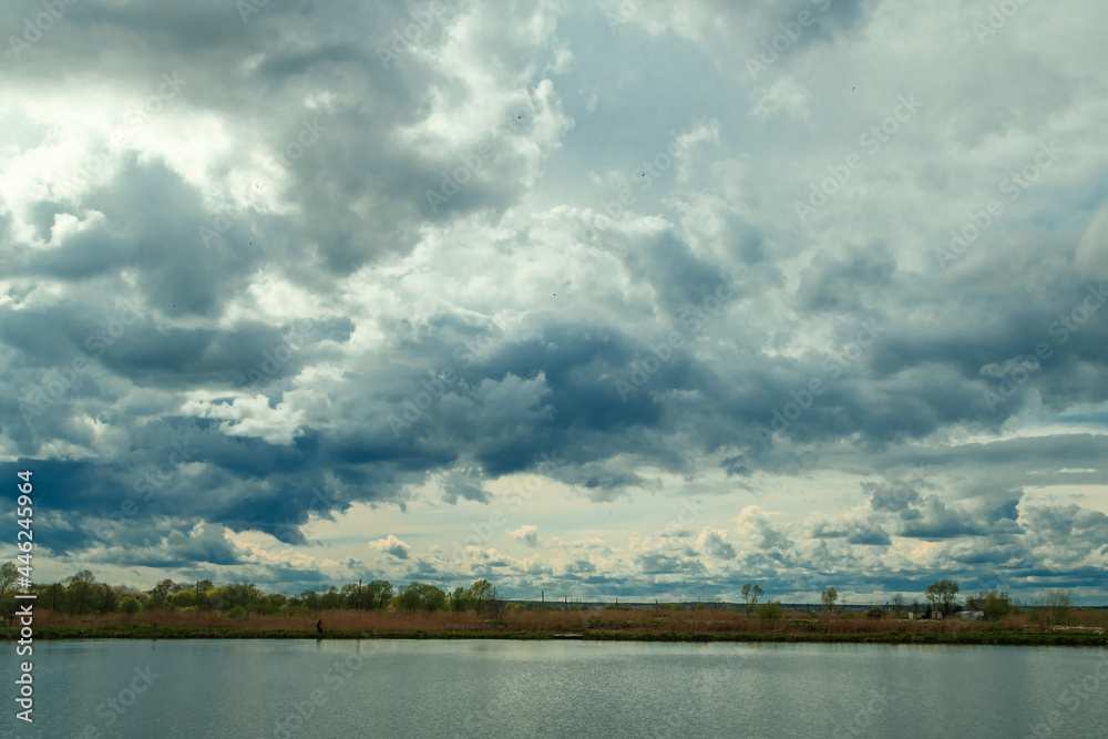 Obraz premium storm clouds over the lake, spring