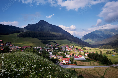 Amazing alpine scenery from Berwang  Austria. Summer landscape with green fields and Alps Mountains.