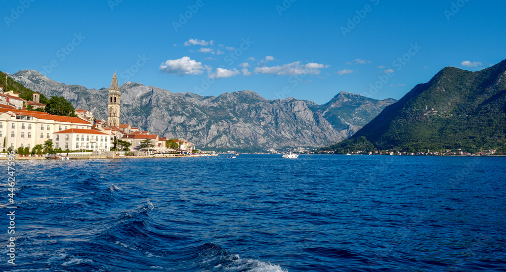 Scenic panorama view of the historic town of Perast. View across Bay of Kotor from shuttle boat. Montenegro, Europe.