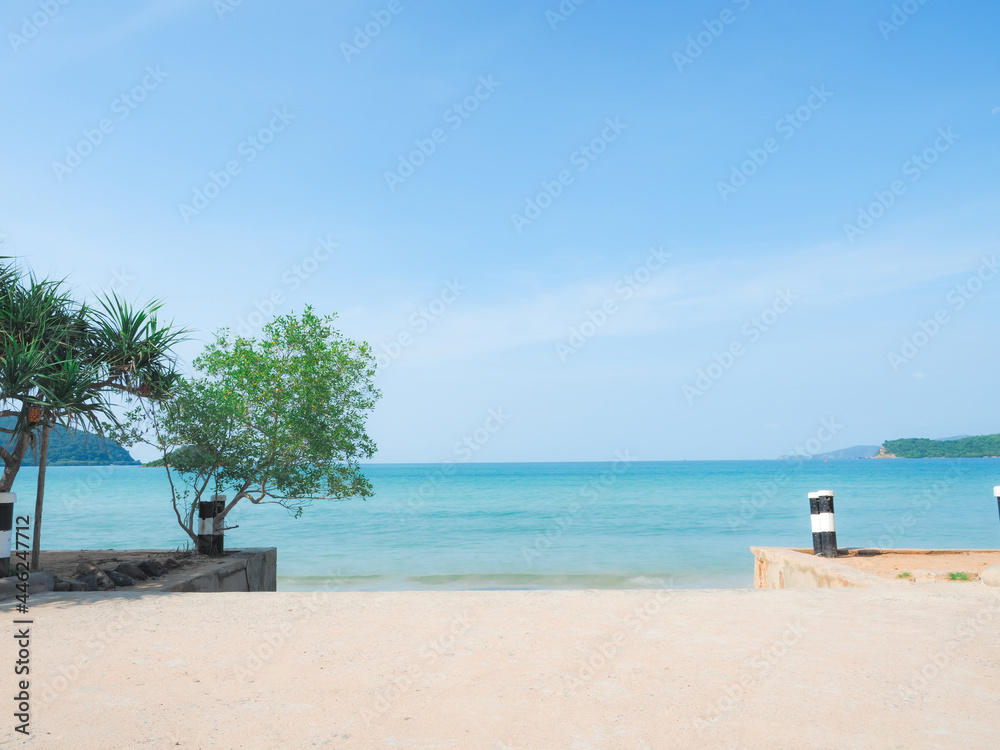 Beautiful beach with blue ocean blue sky and mountain view landscape and bright sunlight at holiday concept image