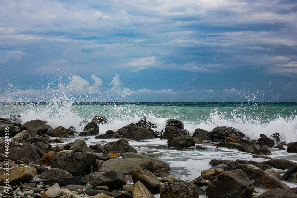 the waves break on the rocks the waves break on the rocks
