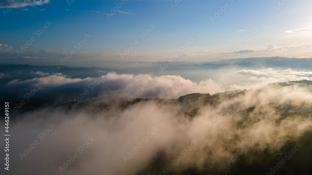 Aerial sunset view over the Blue Ridge Mountains from the aircraft. Sky with clouds. Sky background.