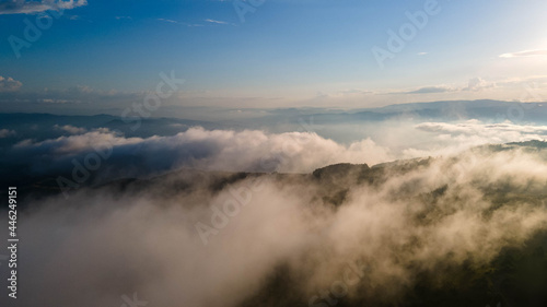 Aerial sunset view over the Blue Ridge Mountains from the aircraft. Sky with clouds. Sky background.