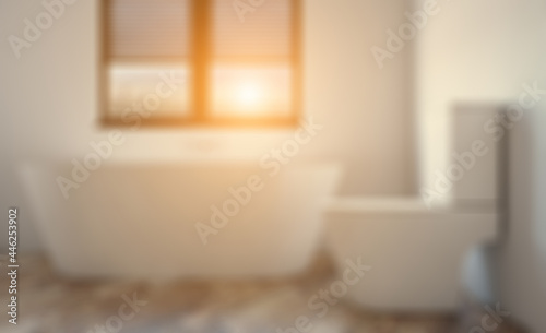 Bokeh blurred phototography. Modern bathroom including bath and sink. 3D rendering.. Sunset.