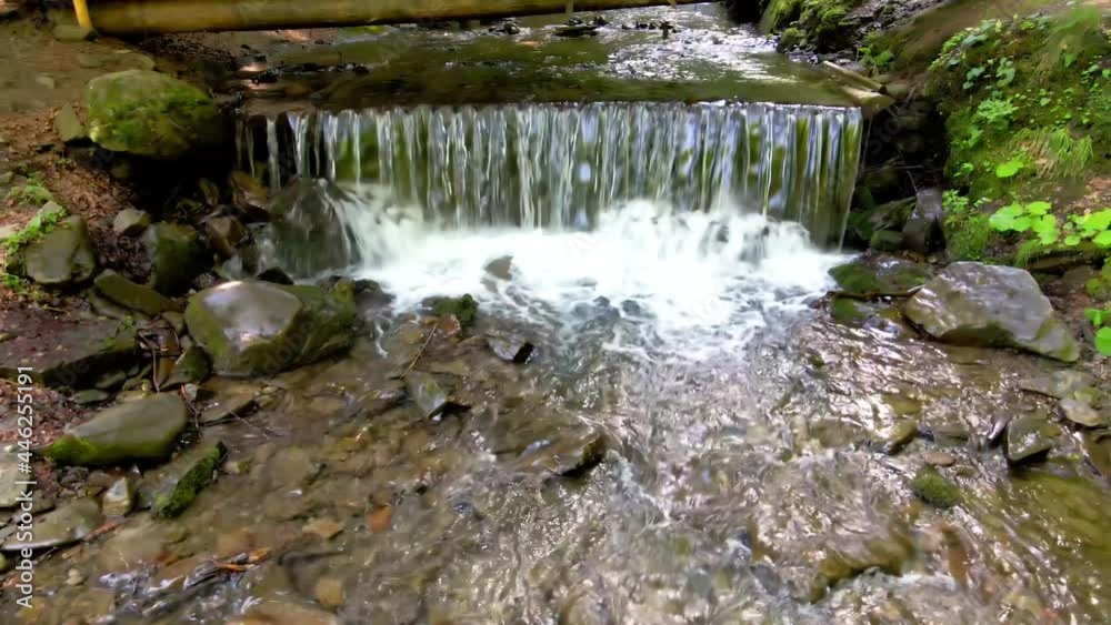 Mountain waterfall in the Carpathians in summer