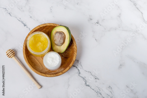 face care. avocado and honey mask. ingredients for home cosmetic face mask