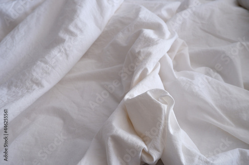 Bed linen texture. White bed linen background. Bed. Interior.